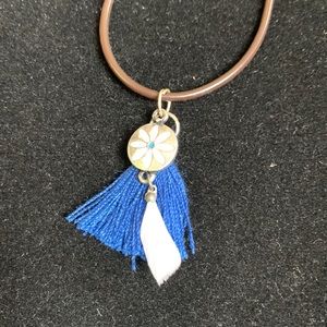 NWOT Boho style necklace. 18 inches. Brown nylon cord.